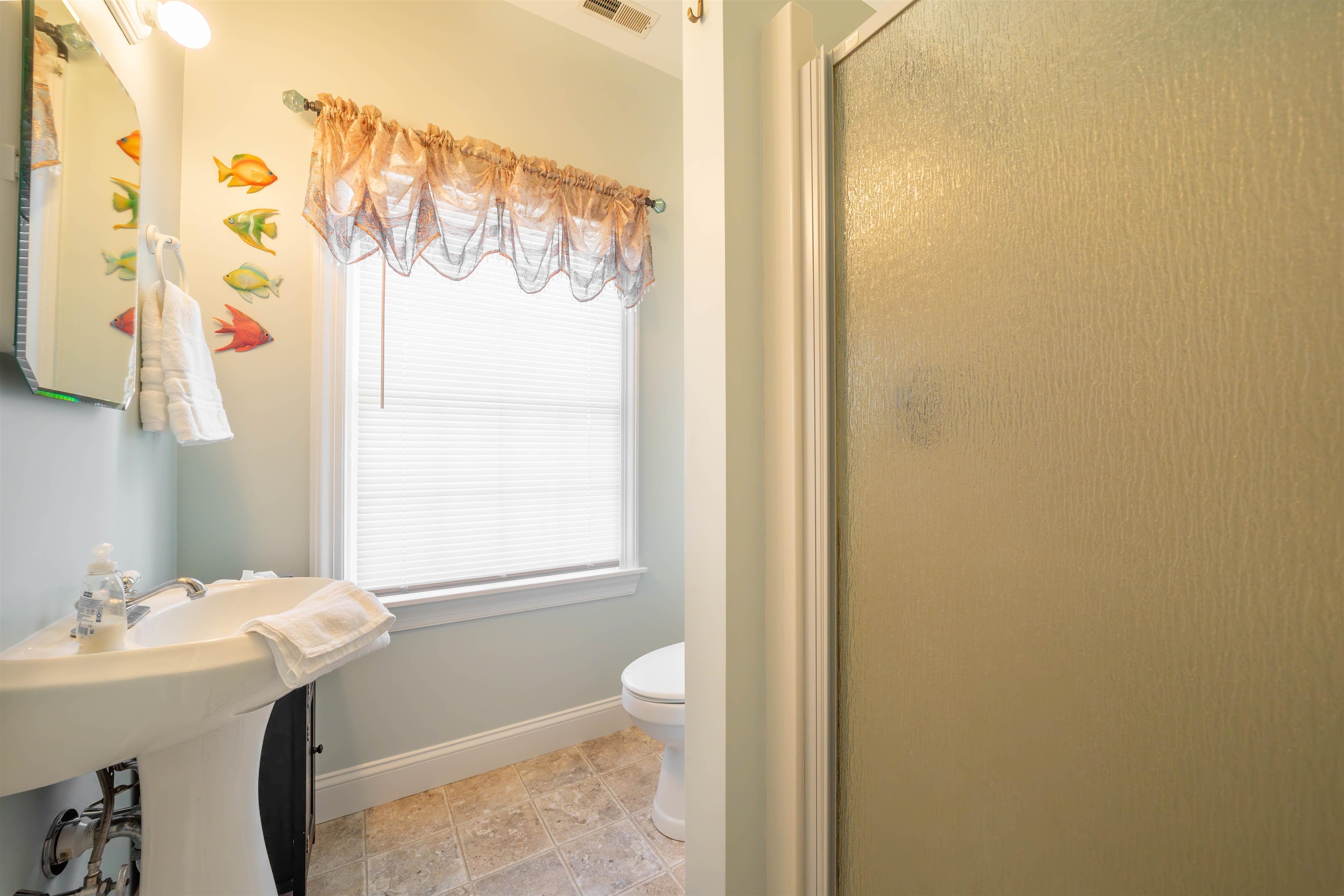 210 3rd West Cape Cape May, NJ 08204 - Photo 24 of 31 a bathroom with a sink and a mirror