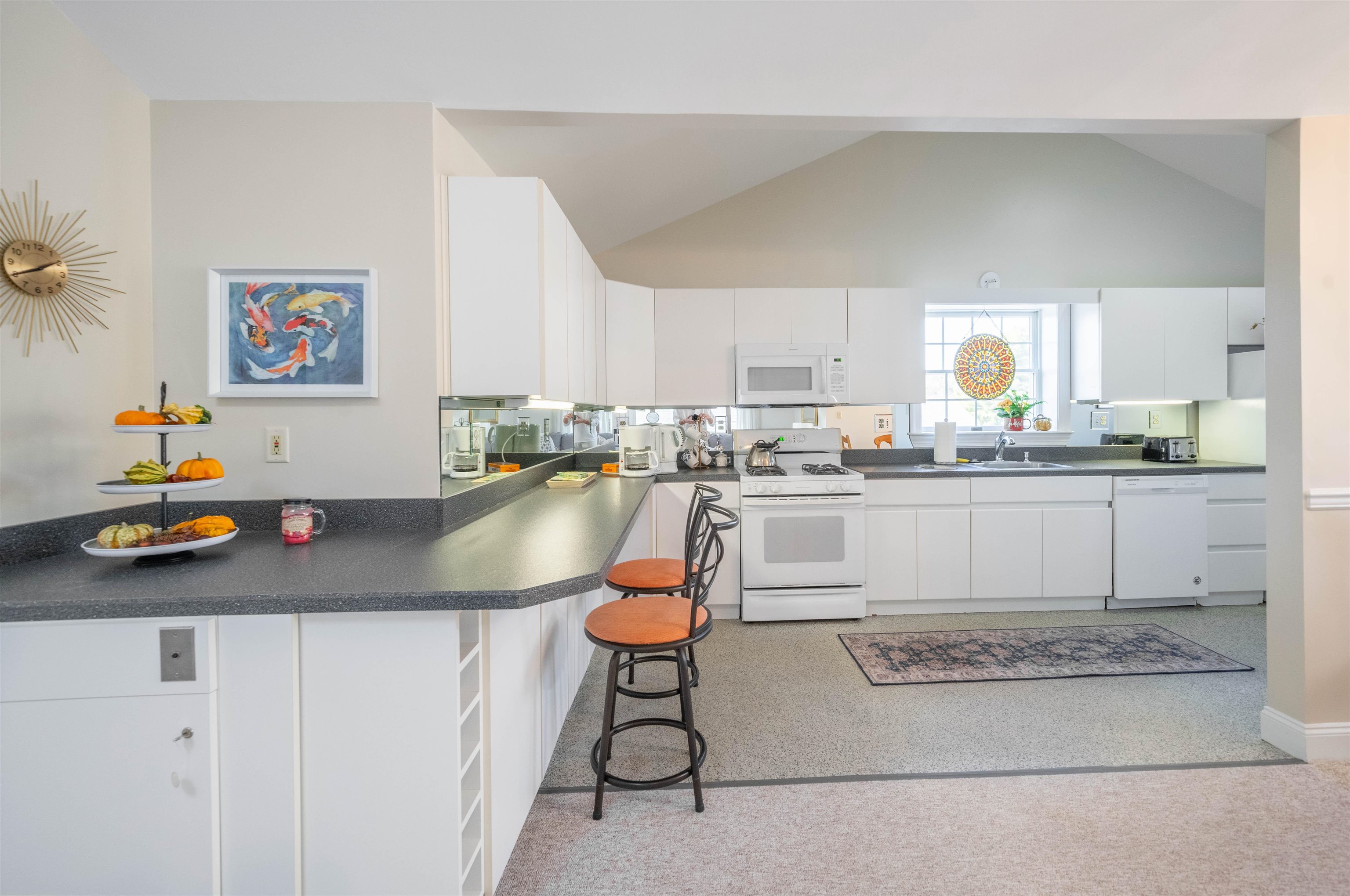 210 3rd West Cape Cape May, NJ 08204 - Photo 9 of 31 a kitchen with stainless steel appliances granite countertop a sink a stove a refrigerator a microwave and dining table
