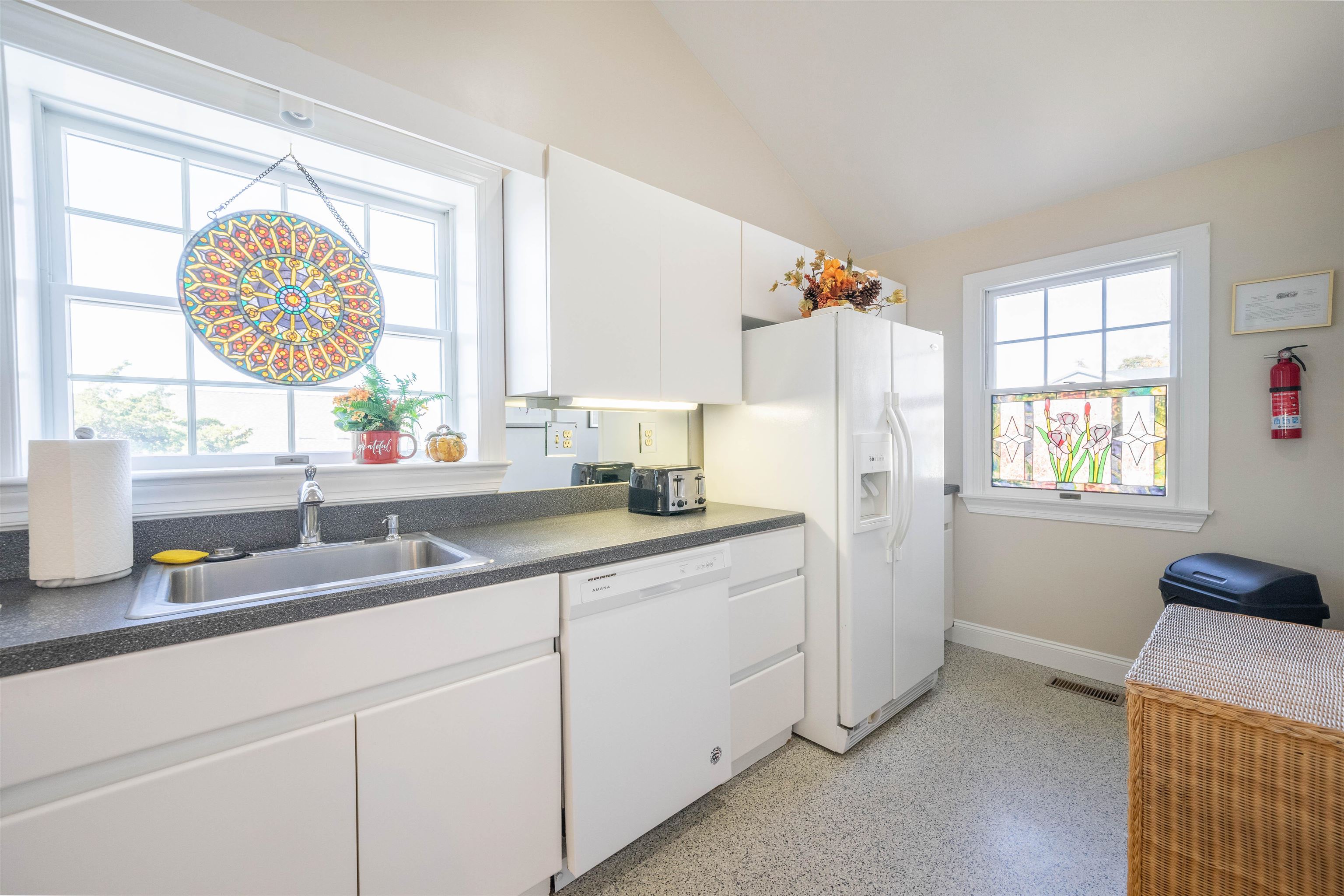 210 3rd West Cape Cape May, NJ 08204 - Photo 10 of 31 a kitchen with a sink cabinets and window
