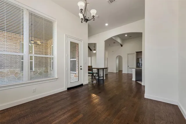 a view of a livingroom with furniture wooden floor and a window