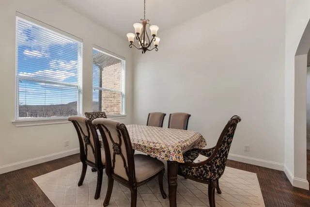 a view of a dining room with furniture and window