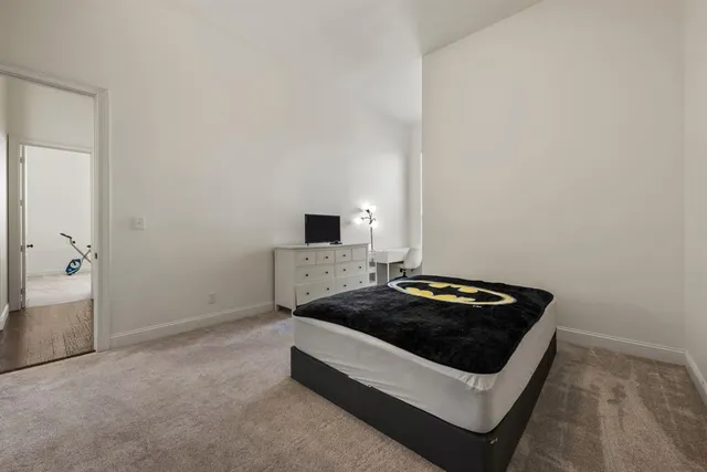 a white kitchen with sink stove and refrigerator
