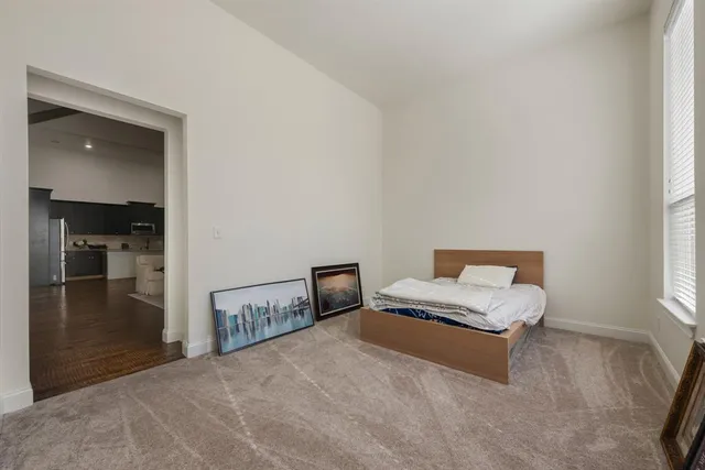a view of a workspace with furniture and a chandelier
