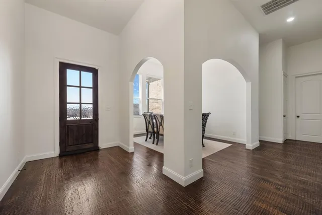 a view of an entryway with wooden floor