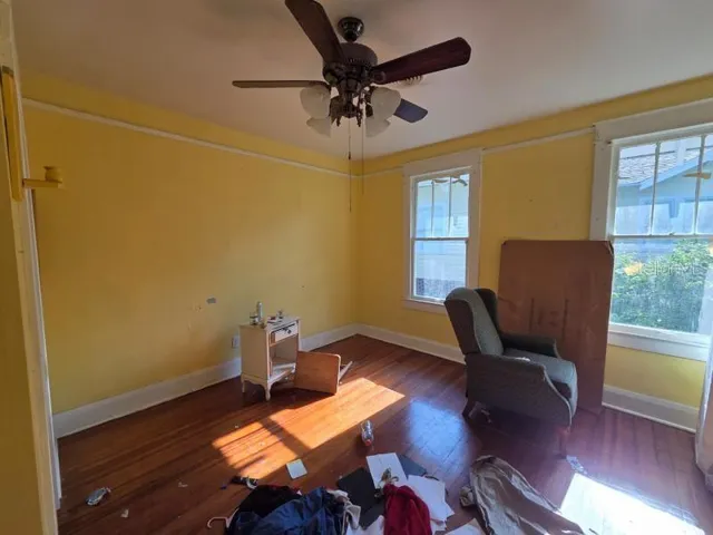a workspace room with furniture and wooden floor