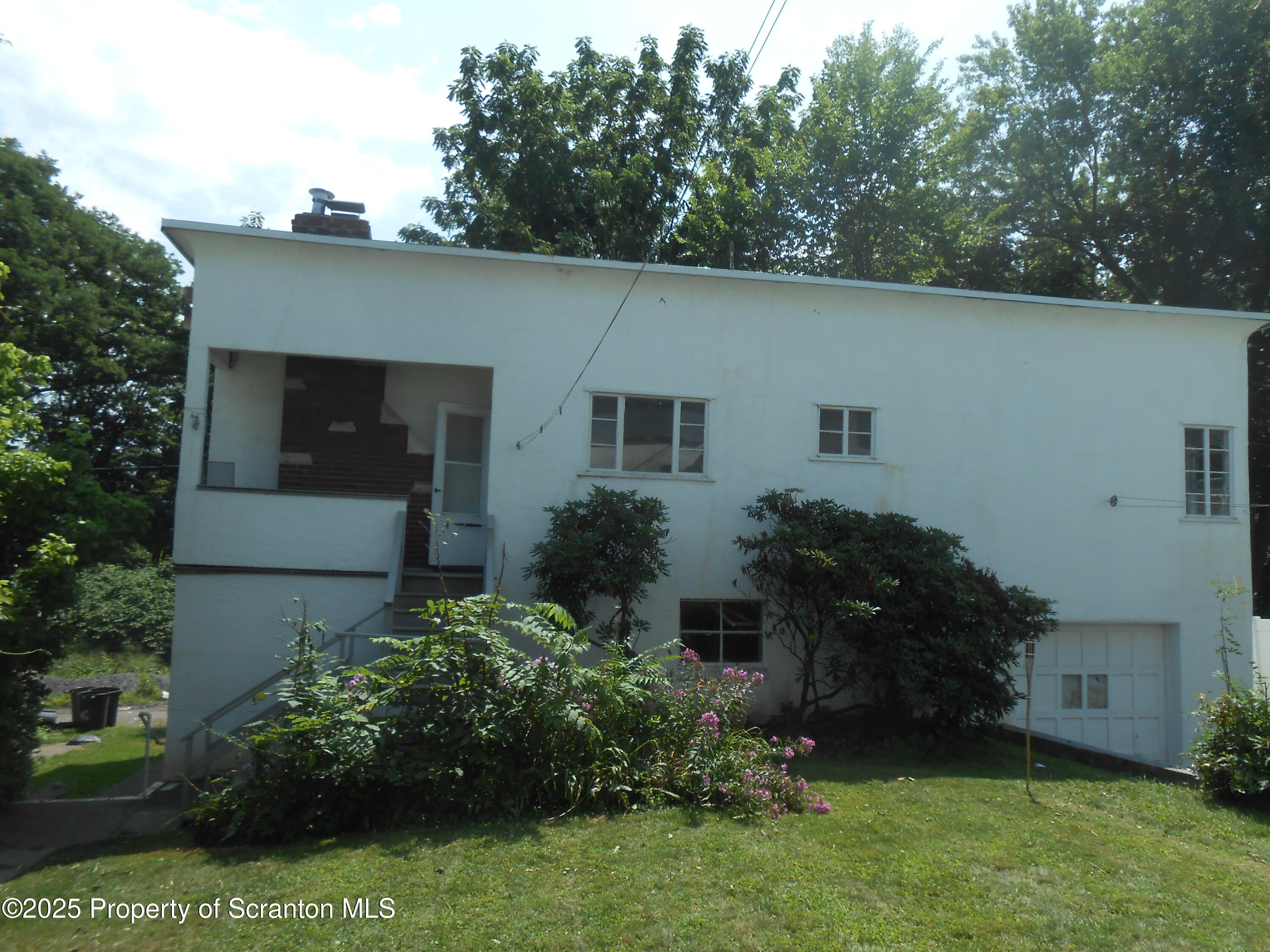 622 North Main Avenue, Unit 7 Scranton, PA 18504 - Photo 1 of 14 front view of house with a yard