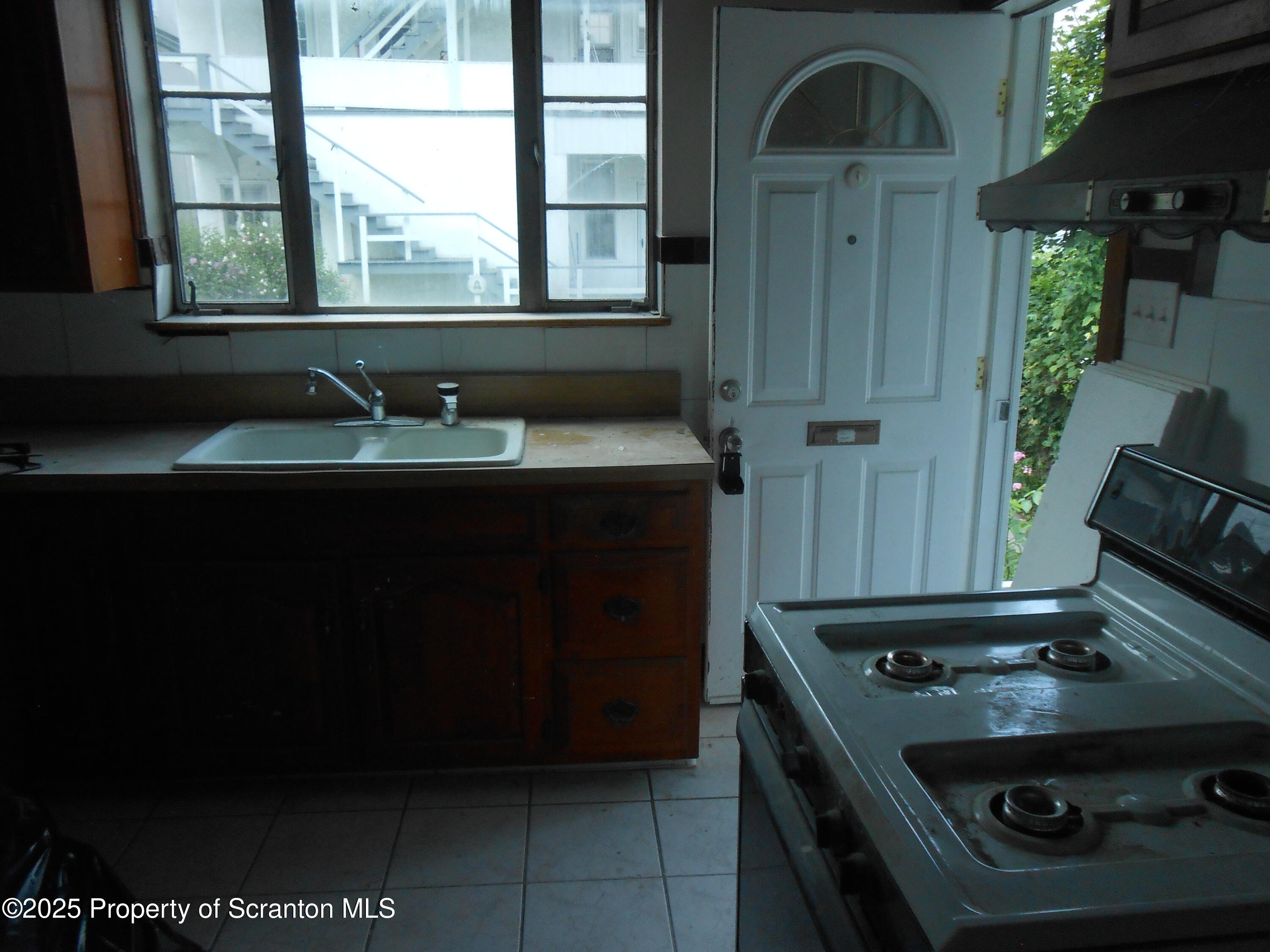 622 North Main Avenue, Unit 7 Scranton, PA 18504 - Photo 3 of 14 a kitchen with a stove and a sink