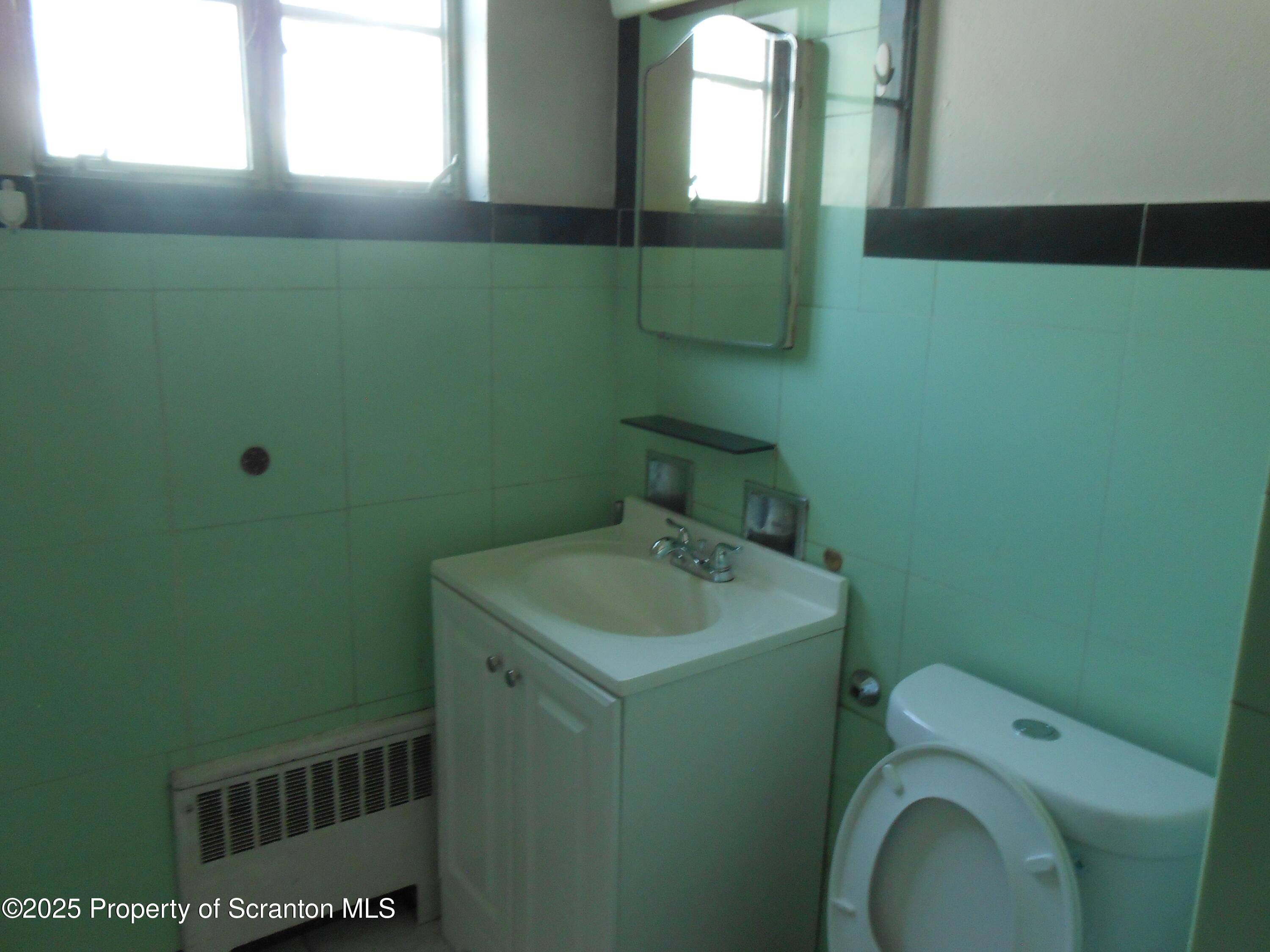 622 North Main Avenue, Unit 7 Scranton, PA 18504 - Photo 4 of 14 a bathroom with sink toilet and mirror