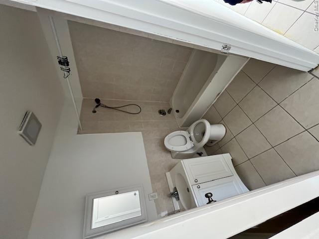 94 Roger Avenue Inwood, NY 11096 - Photo 13 of 28 a bathroom with a bathtub sink mirror and toilet