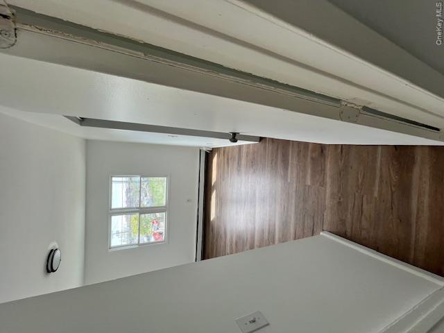 94 Roger Avenue Inwood, NY 11096 - Photo 16 of 28 a view of a hallway view with wooden floor and staircase