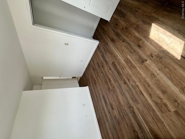 94 Roger Avenue Inwood, NY 11096 - Photo 19 of 28 a view of an empty room and wooden floor
