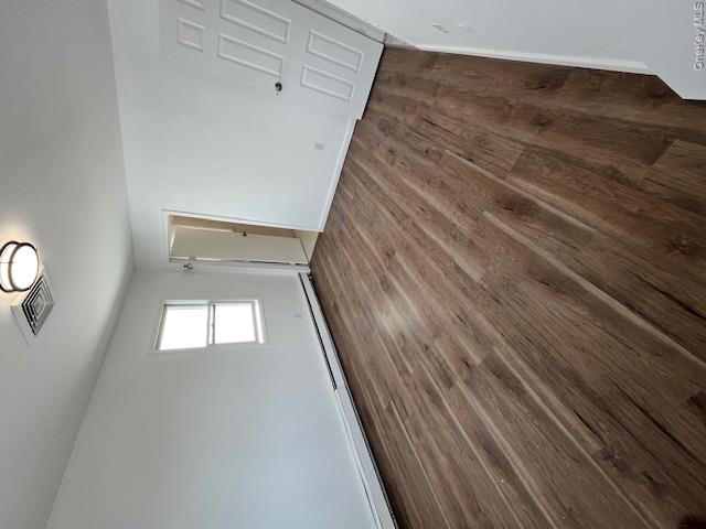 94 Roger Avenue Inwood, NY 11096 - Photo 2 of 28 an empty room with wooden floor and windows