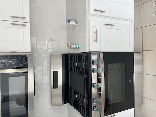 94 Roger Avenue Inwood, NY 11096 - Photo 21 of 28 a stove top oven sitting inside of a kitchen