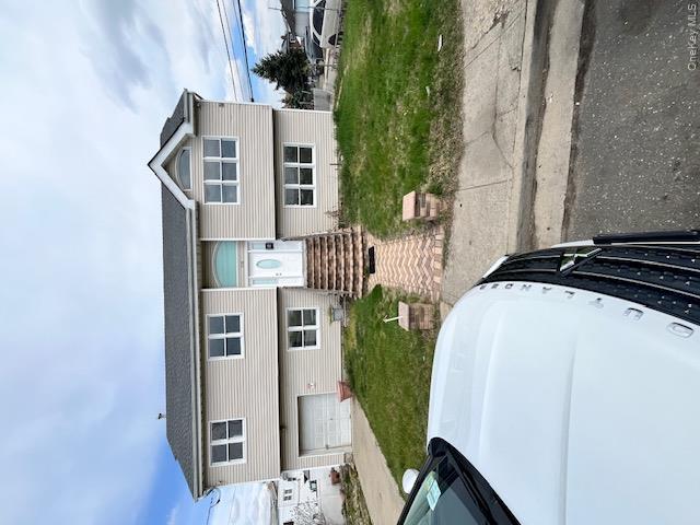 94 Roger Avenue Inwood, NY 11096 - Photo 3 of 28 a front view of a house with garden
