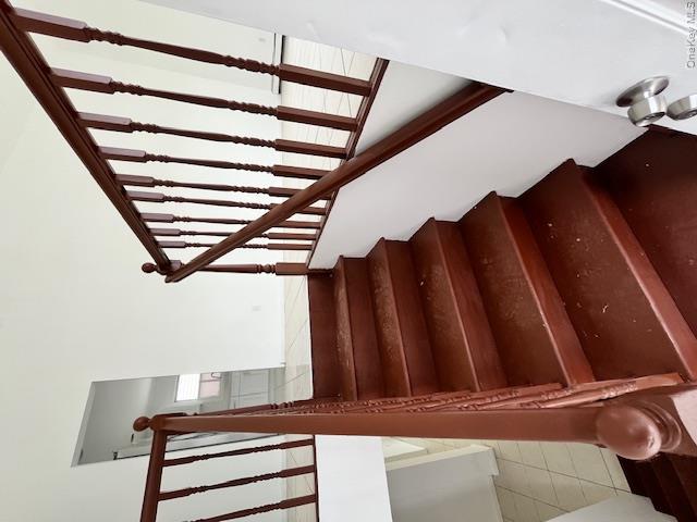 94 Roger Avenue Inwood, NY 11096 - Photo 7 of 28 a view of staircase with wooden floor and stairs
