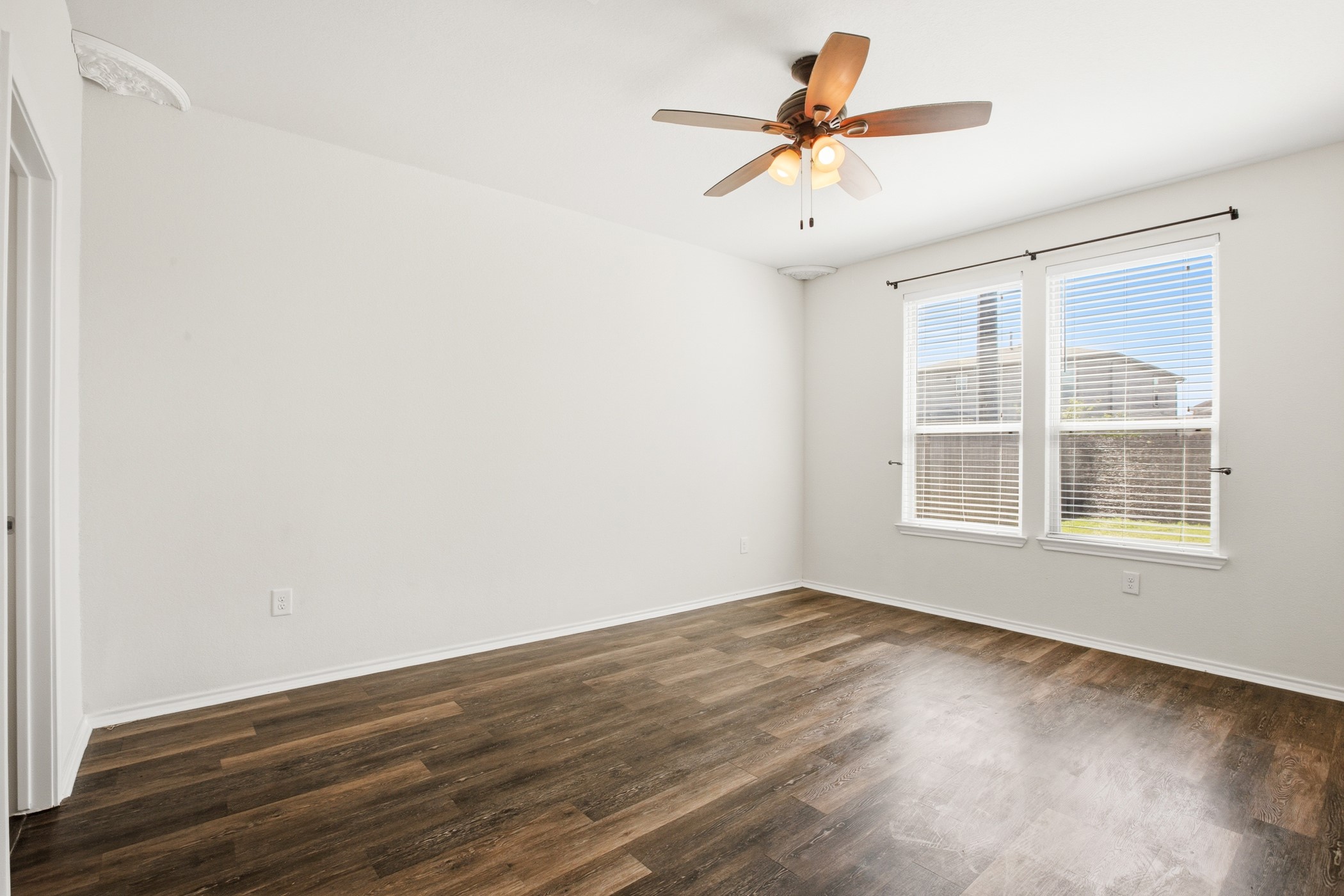 4611 Windmill Run Drive Houston, TX 77069 - Photo 17 of 35 wooden floor in an empty room with a window