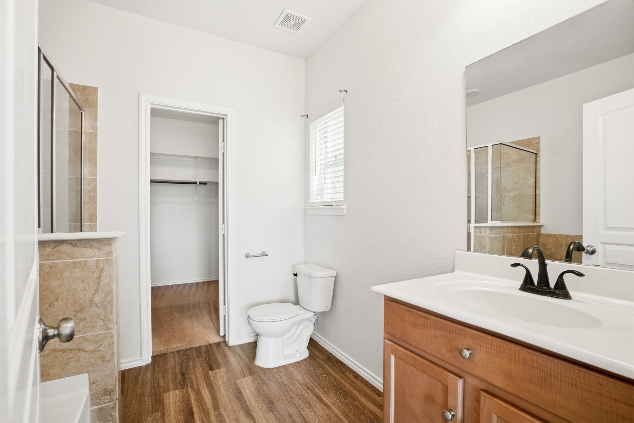 4611 Windmill Run Drive Houston, TX 77069 - Photo 21 of 35 a bathroom with a sink and a mirror