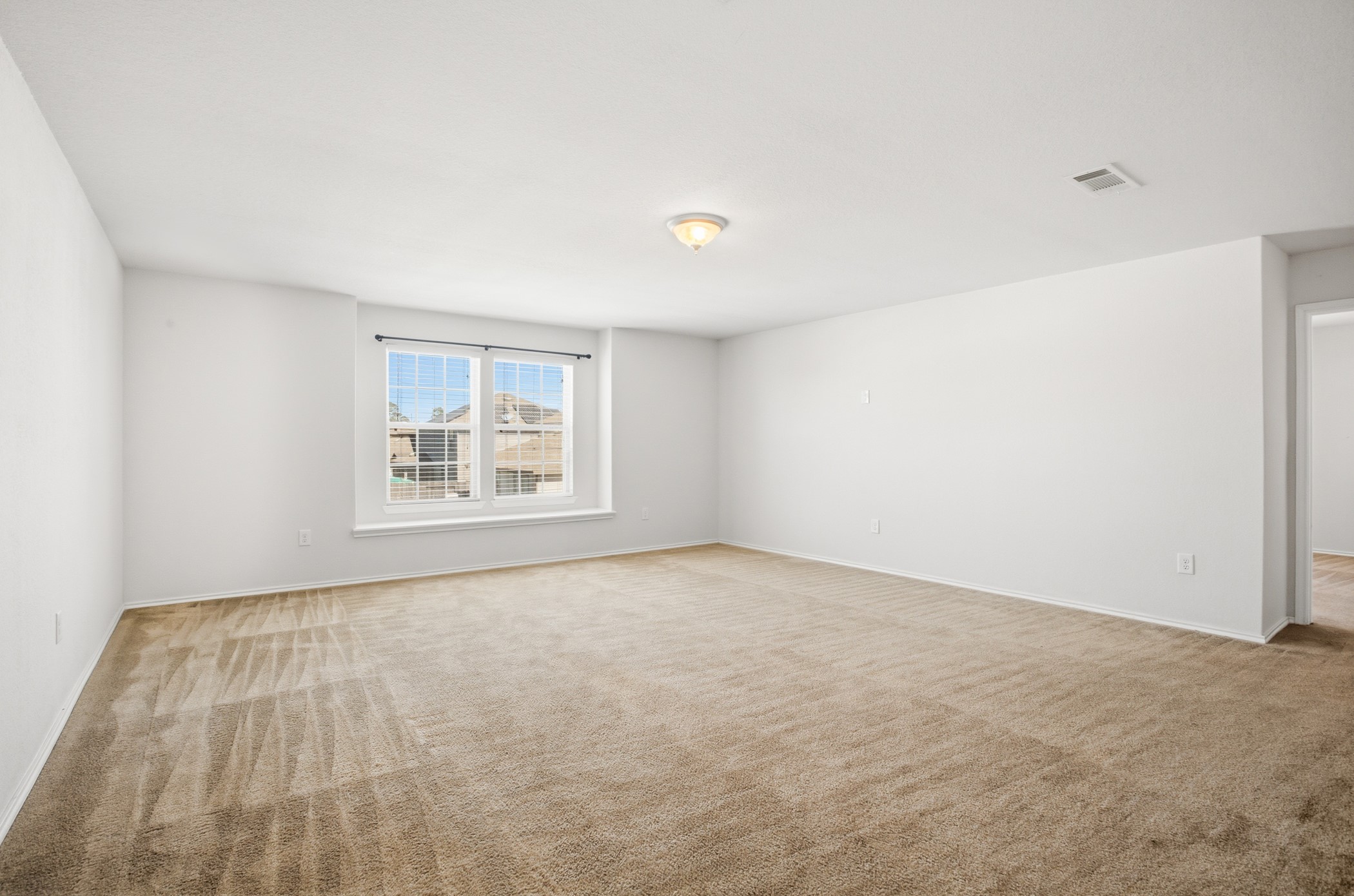 4611 Windmill Run Drive Houston, TX 77069 - Photo 26 of 35 a view of an empty room with a window
