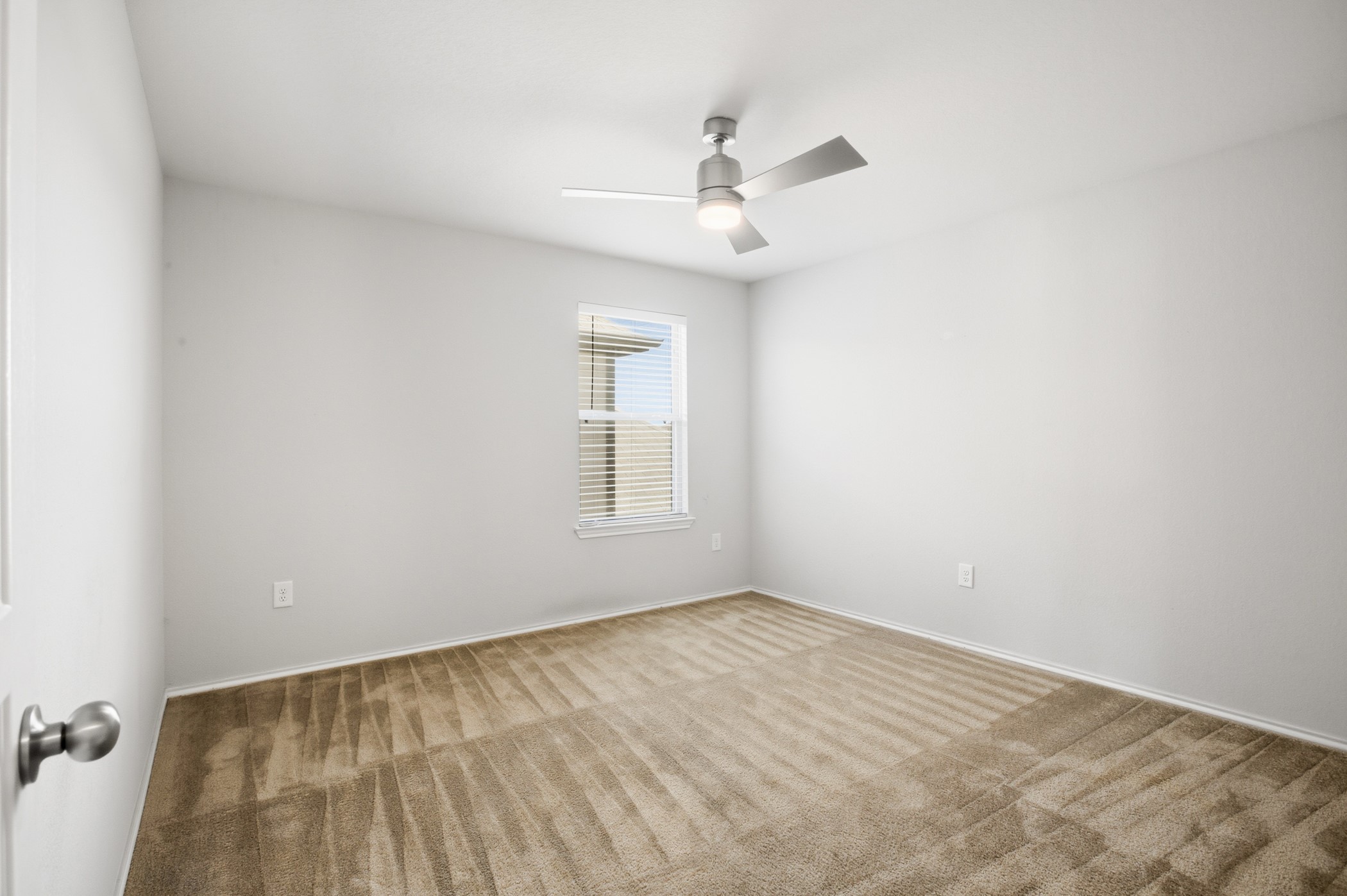 4611 Windmill Run Drive Houston, TX 77069 - Photo 29 of 35 wooden floor in an empty room with a window