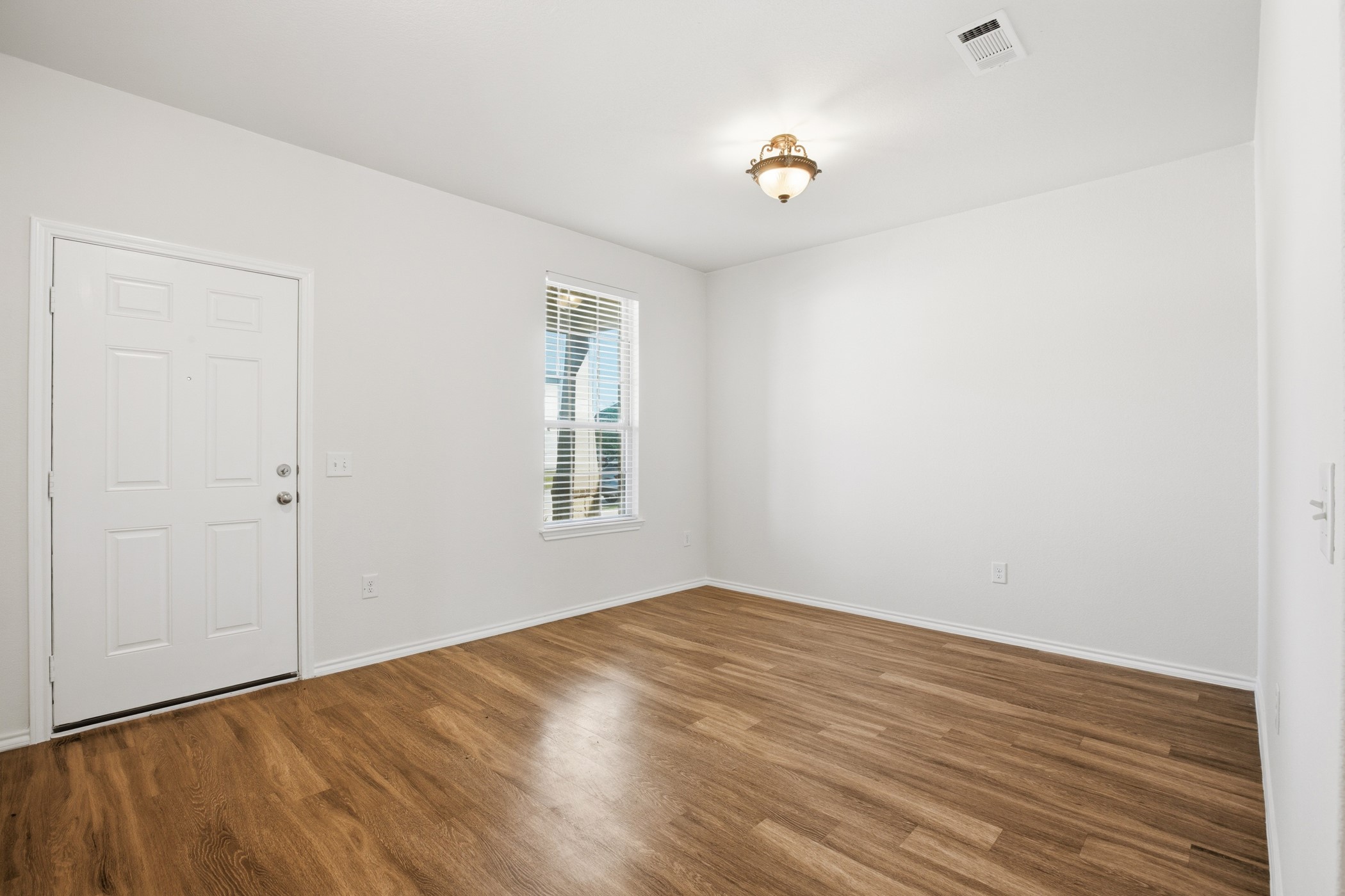 4611 Windmill Run Drive Houston, TX 77069 - Photo 7 of 35 a view of empty room with wooden floor and fan