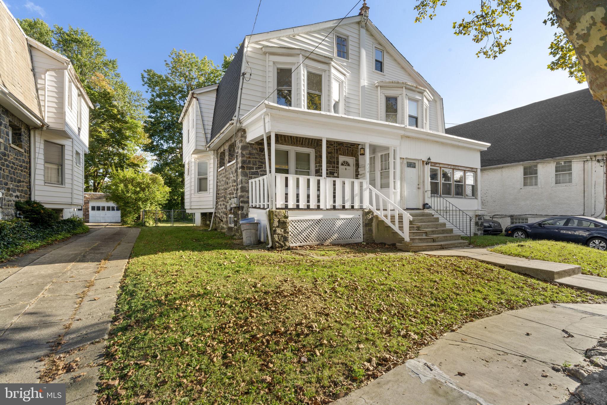 724 Ash Avenue, Unit 2 Collingdale, PA 19023 - Photo 1 of 17 a front view of a house with a yard