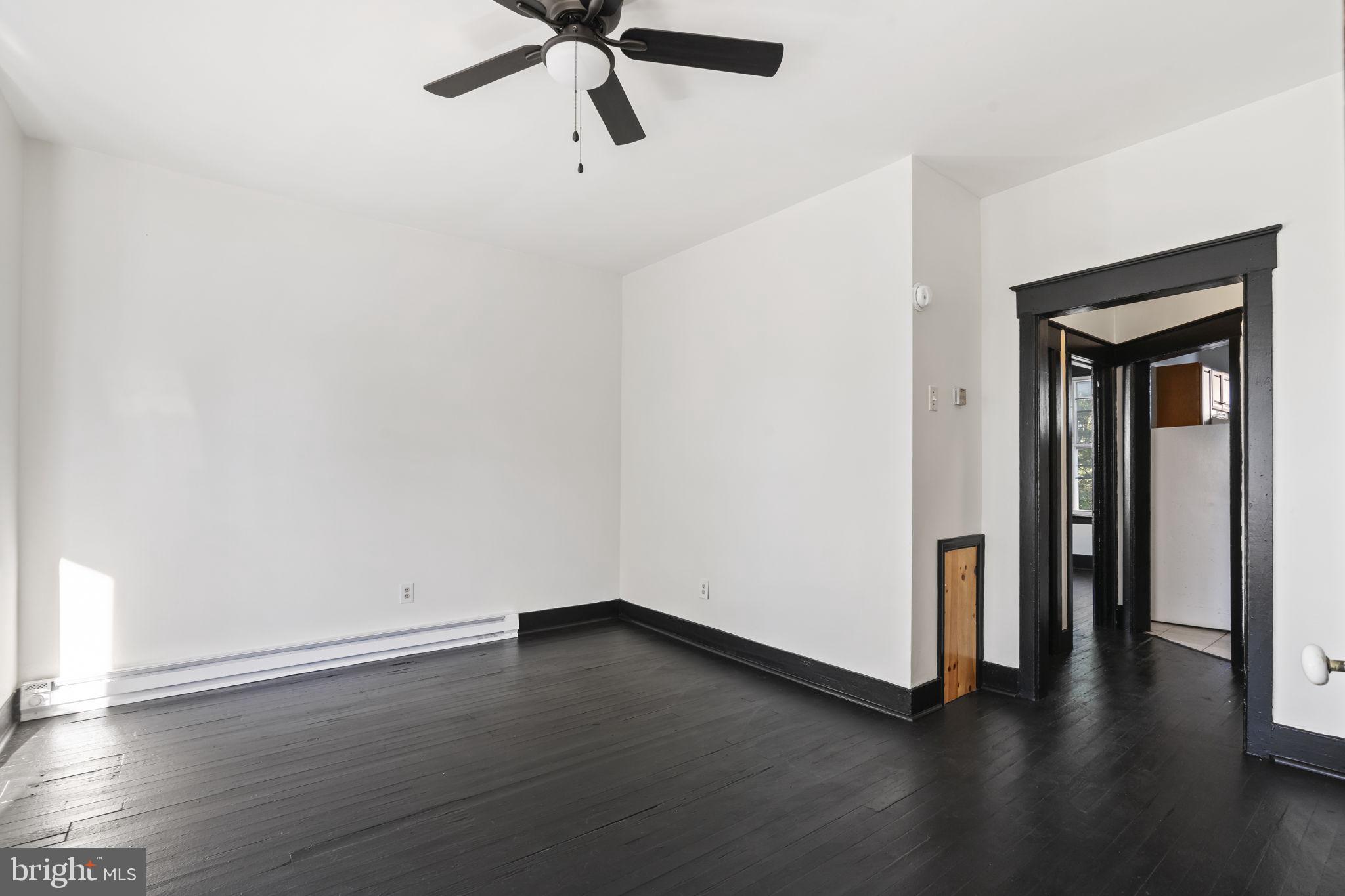 724 Ash Avenue, Unit 2 Collingdale, PA 19023 - Photo 4 of 17 wooden floor in an empty room
