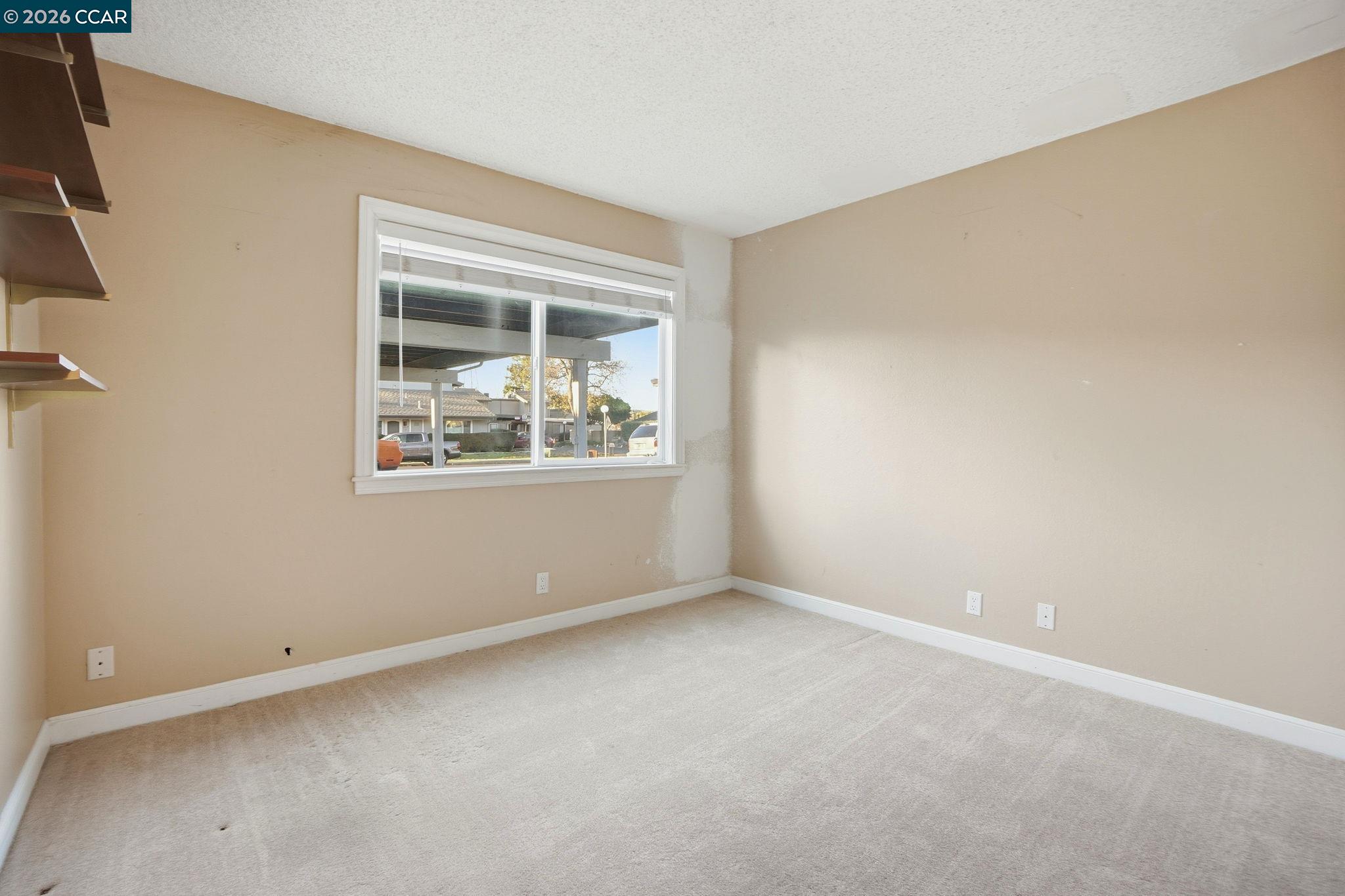 1160 Kenwal Road, Unit D Concord, CA 94521 - Photo 15 of 38 a view of an empty room with a window