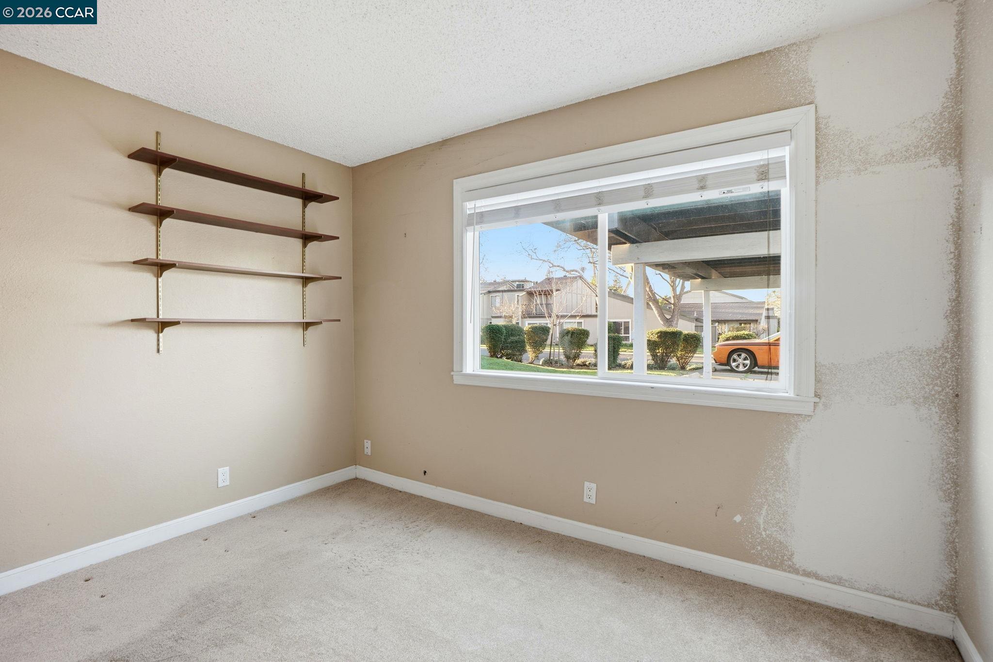 1160 Kenwal Road, Unit D Concord, CA 94521 - Photo 18 of 38 a view of an empty room with a window