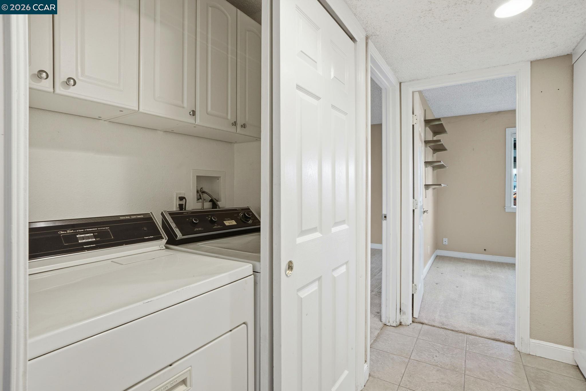 1160 Kenwal Road, Unit D Concord, CA 94521 - Photo 28 of 38 a view of storage and utility room with washer and dryer