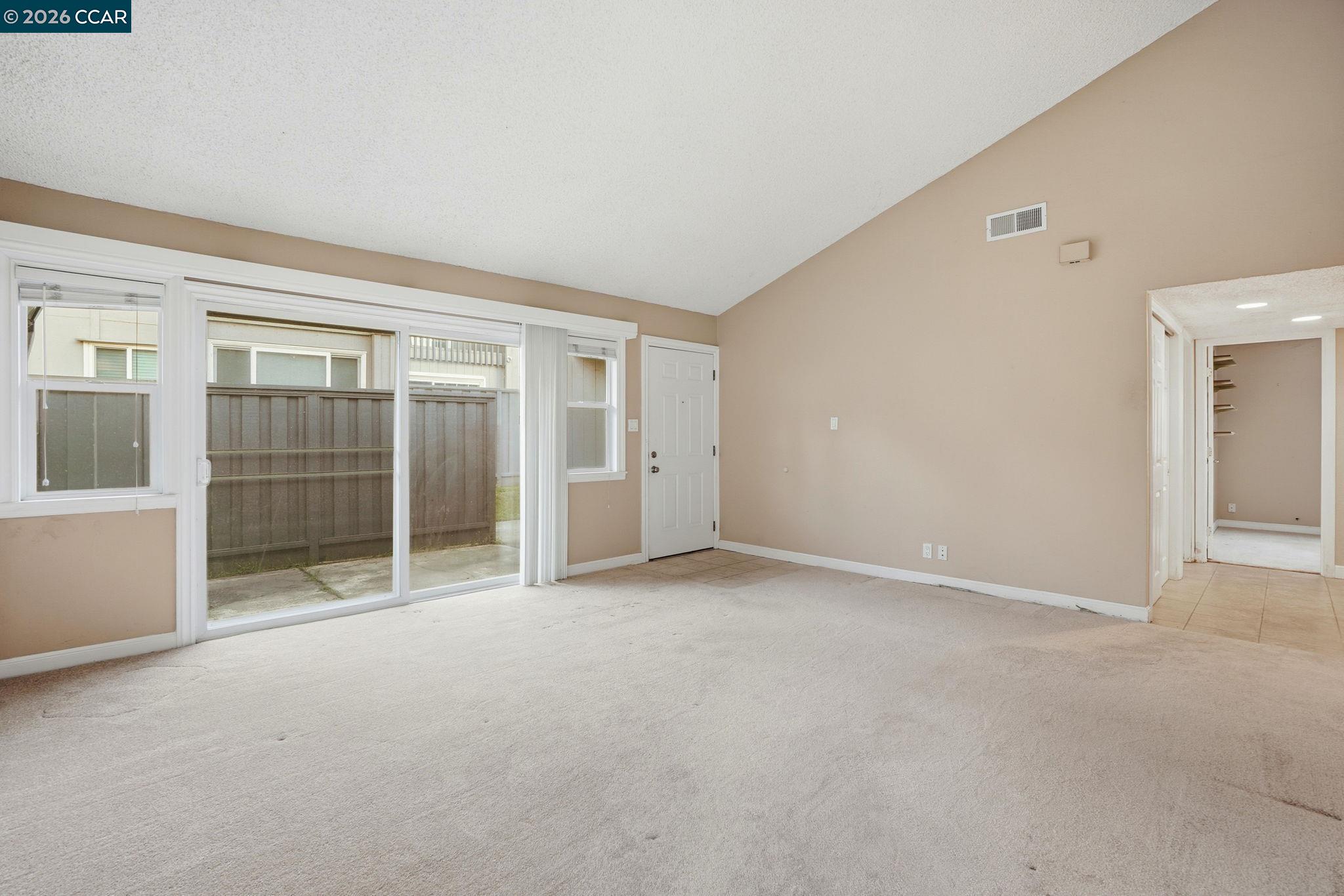 1160 Kenwal Road, Unit D Concord, CA 94521 - Photo 7 of 38 a view of an empty room with a window