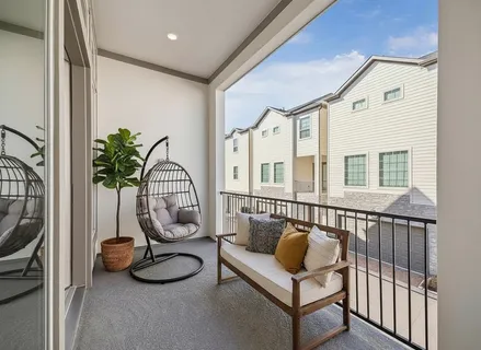 a kitchen with a sink a stove a refrigerator and white cabinets
