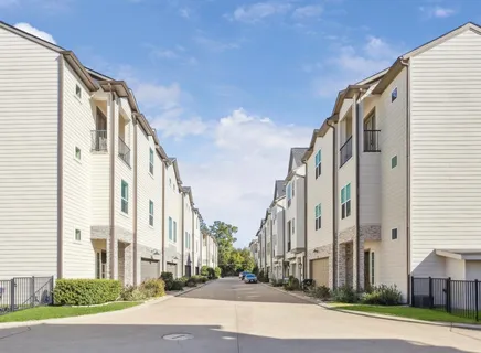 a view of a building with potted plants