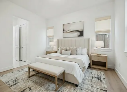 a view of an entryway with wooden floor and door