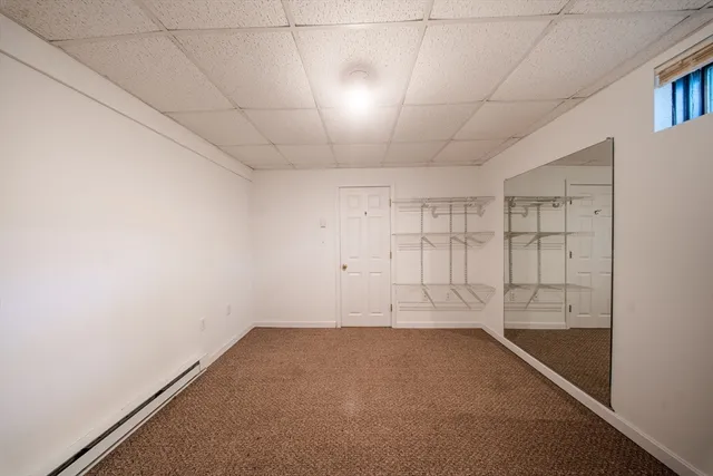 an empty room with a empty space and windows