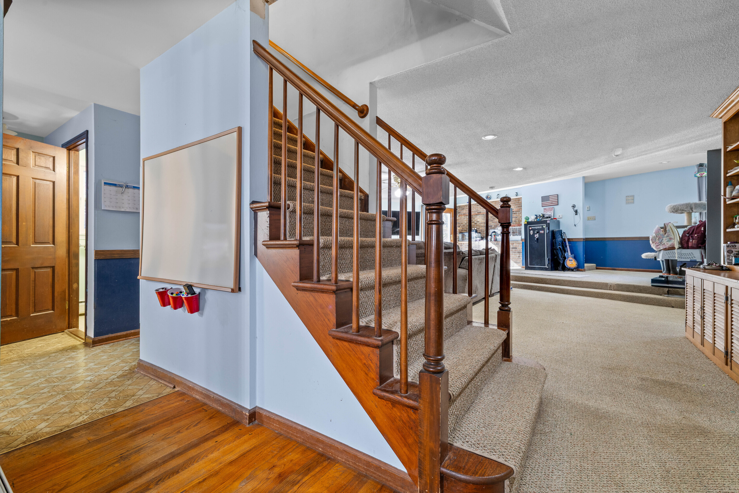 63 Burr Road Haddam, CT 06441 - Photo 17 of 38 a view of staircase with lots of frames on wall and a window