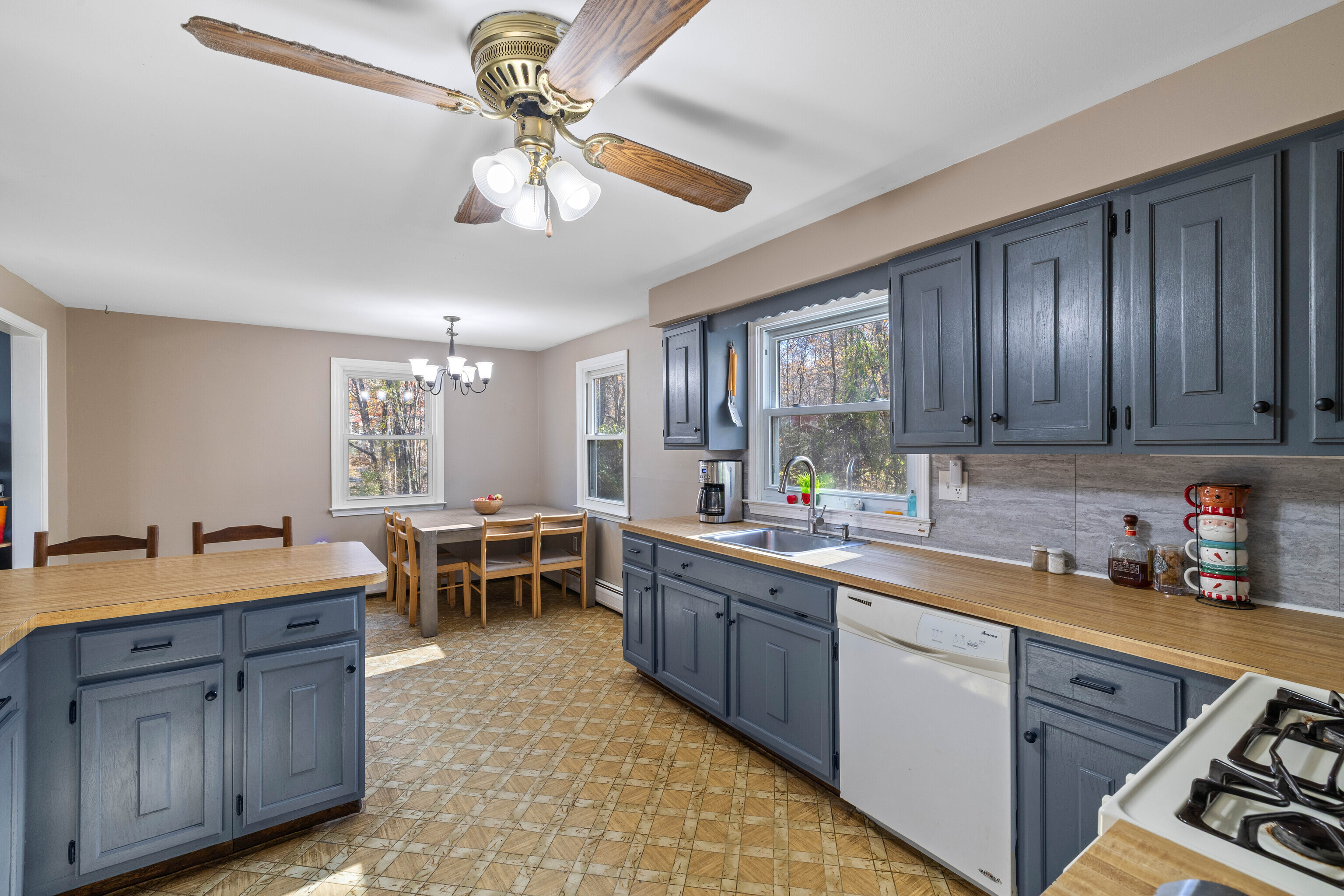 63 Burr Road Haddam, CT 06441 - Photo 19 of 38 a kitchen with a sink stove and cabinets