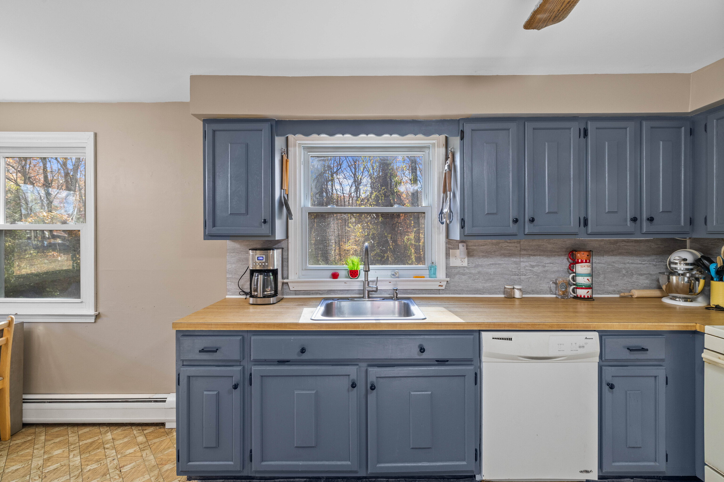 63 Burr Road Haddam, CT 06441 - Photo 20 of 38 a kitchen with a sink a window and cabinets