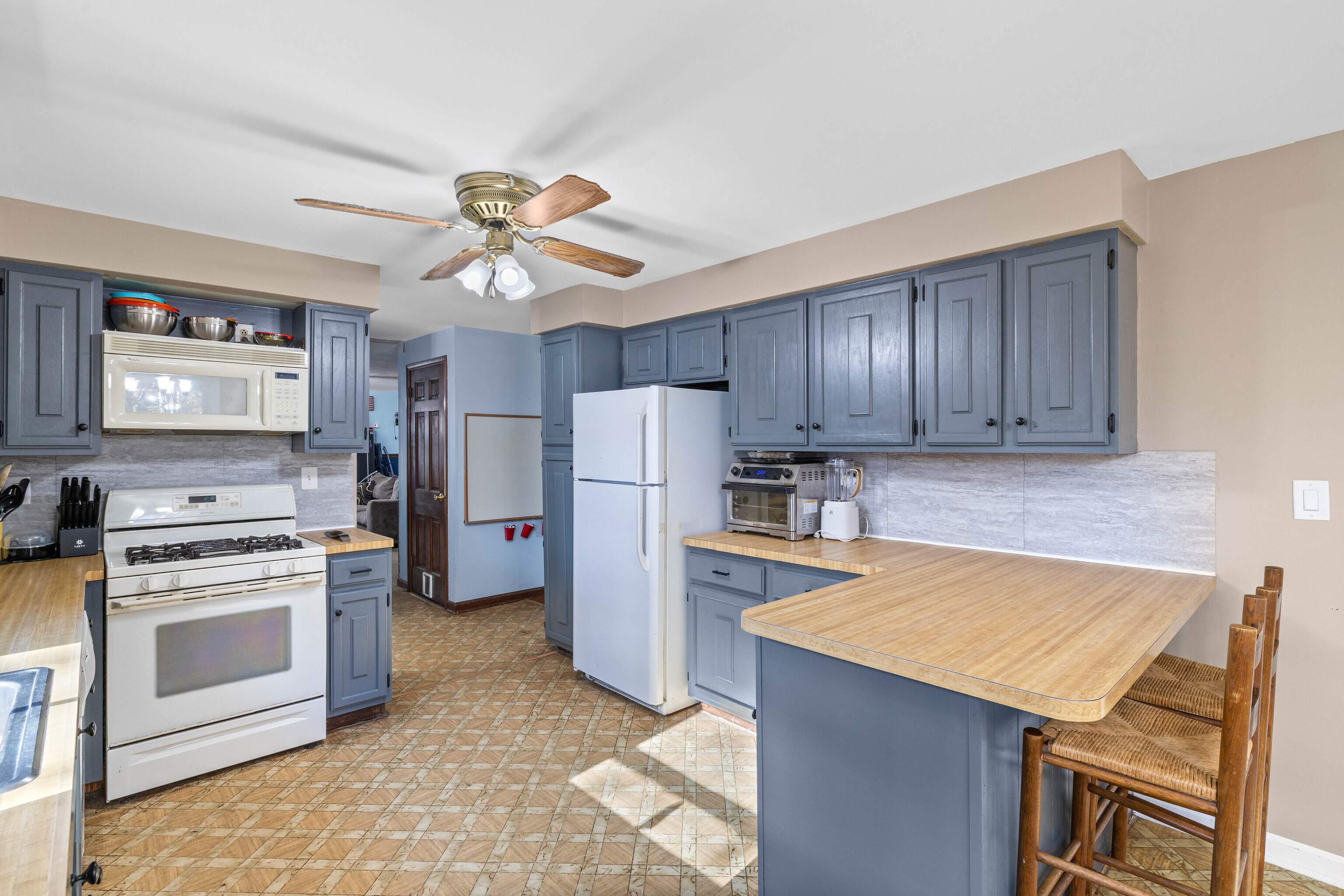 63 Burr Road Haddam, CT 06441 - Photo 22 of 38 a kitchen with a stove a refrigerator and a sink