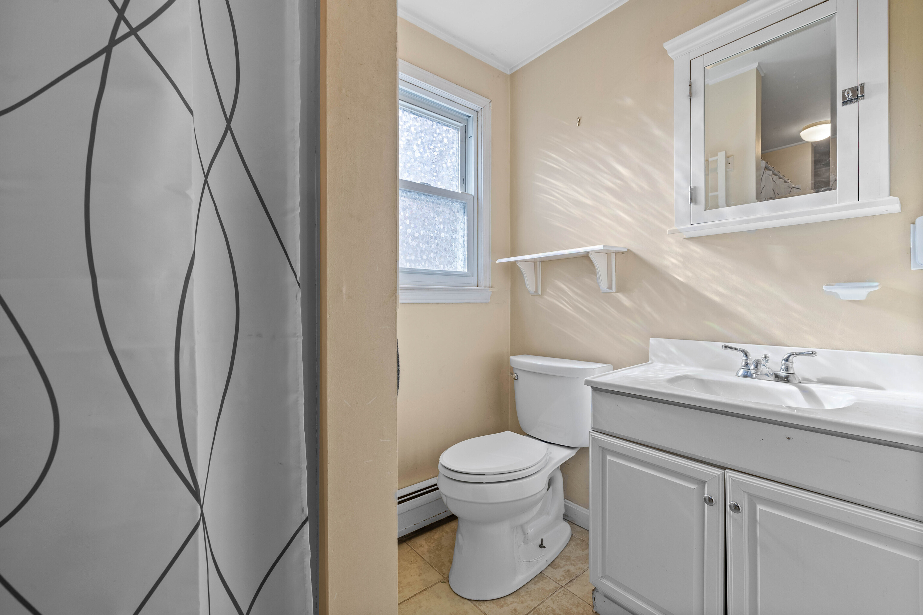 63 Burr Road Haddam, CT 06441 - Photo 29 of 38 a bathroom with a toilet sink and mirror