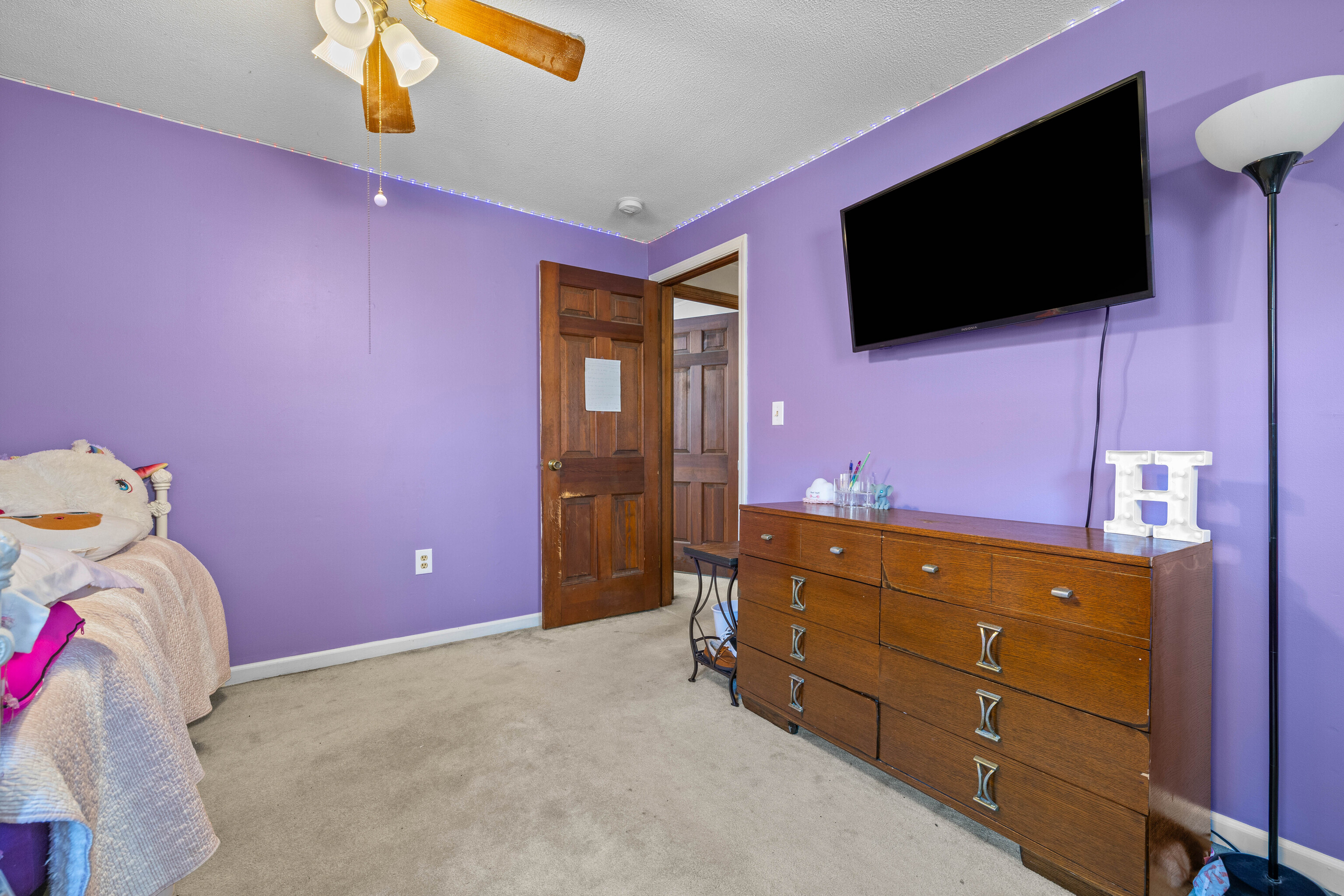 63 Burr Road Haddam, CT 06441 - Photo 33 of 38 a living room with a bed and a flat screen tv