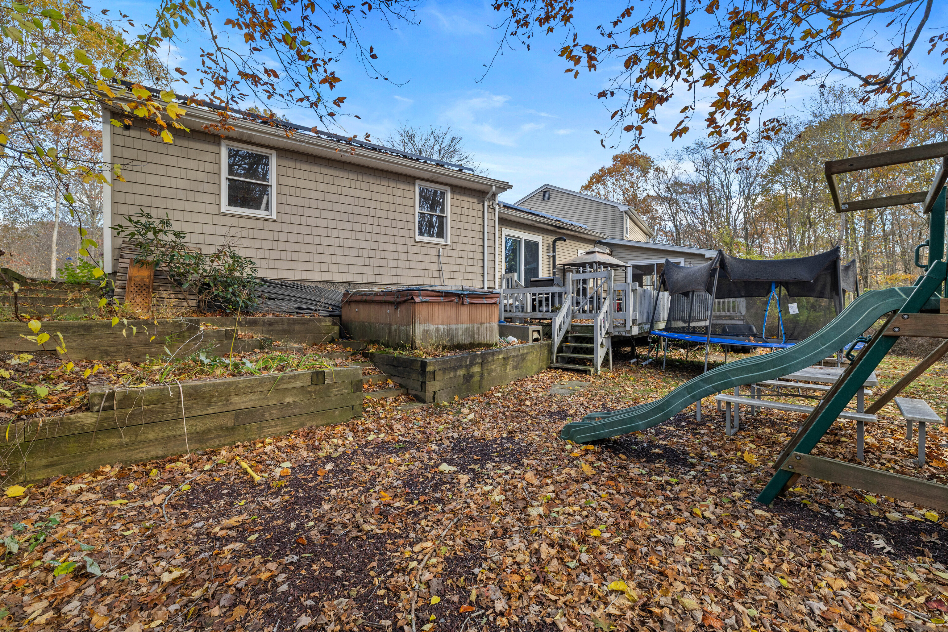 63 Burr Road Haddam, CT 06441 - Photo 35 of 38 a view of a house with backyard and sitting area