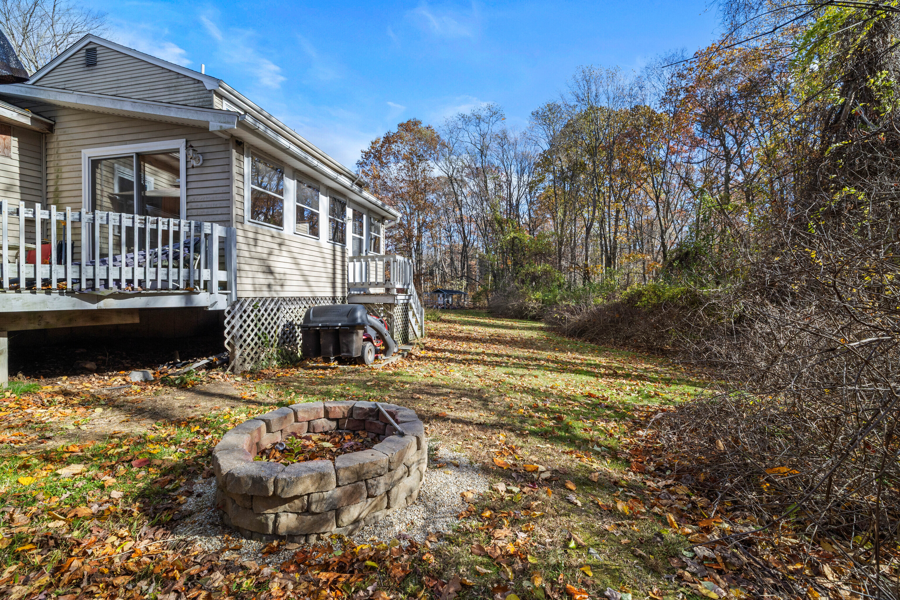 63 Burr Road Haddam, CT 06441 - Photo 36 of 38 a view of a chair and tables in the patio