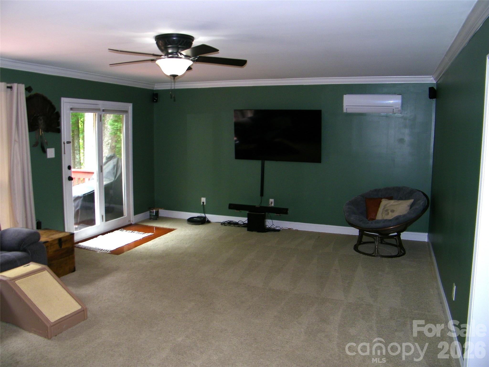 609 Redah Avenue Locust, NC 28097 - Photo 9 of 37 a living room with furniture and a ceiling fan