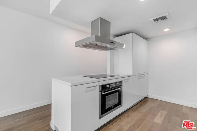 a kitchen with a stove and a microwave