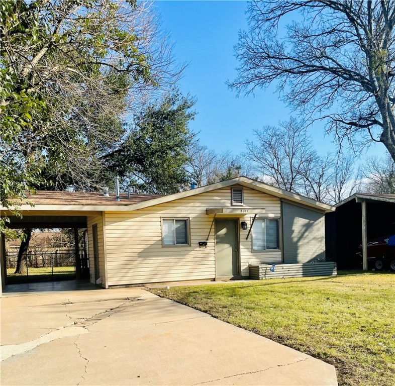 8315 Reeda Lane Austin, TX 78757 - Photo 1 of 1 a front view of a house with a yard and garage