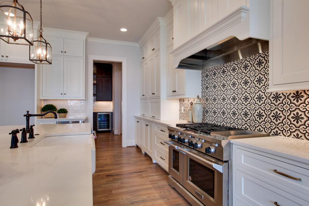 112 Alton Road Nashville, TN 37205 - Photo 13 of 30 a kitchen with granite countertop a stove and a sink