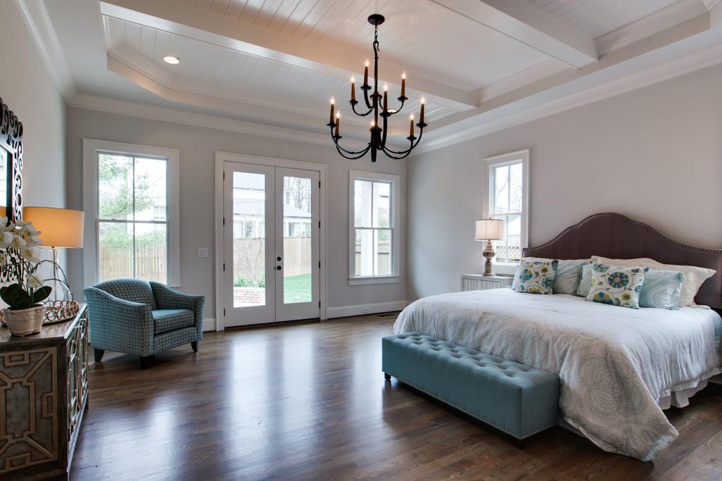 112 Alton Road Nashville, TN 37205 - Photo 18 of 30 a bedroom with a bed ceiling fan and a large window