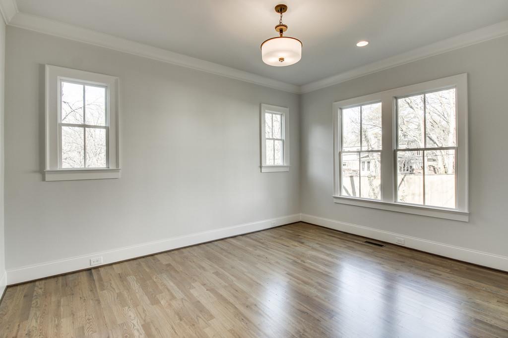 112 Alton Road Nashville, TN 37205 - Photo 22 of 30 an empty room with wooden floor and windows