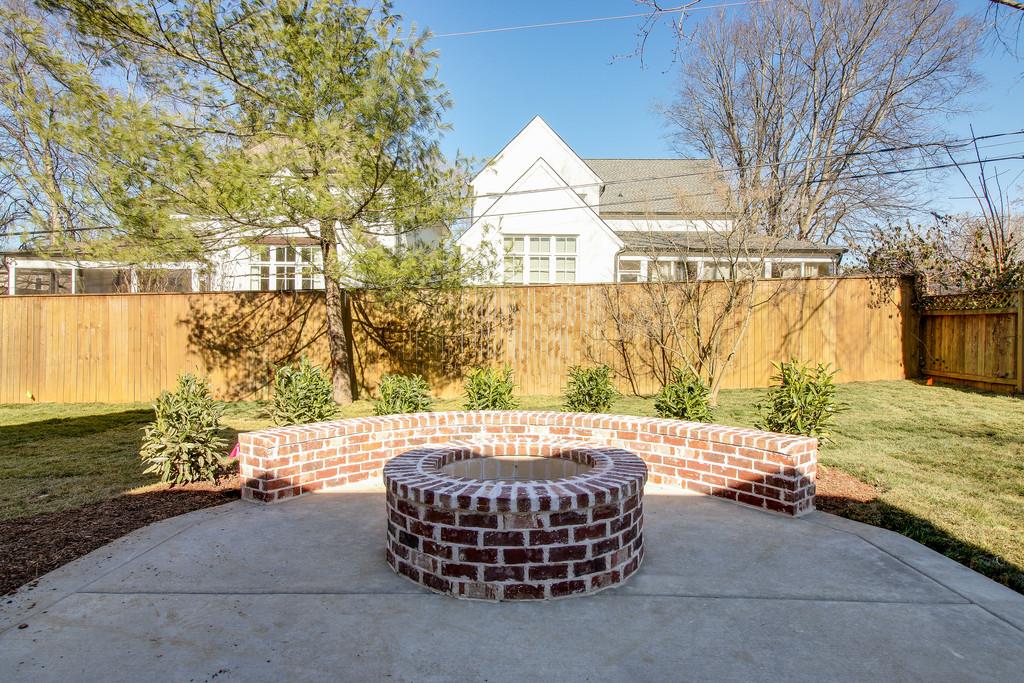 112 Alton Road Nashville, TN 37205 - Photo 29 of 30 a wooden bench sitting in front of a building