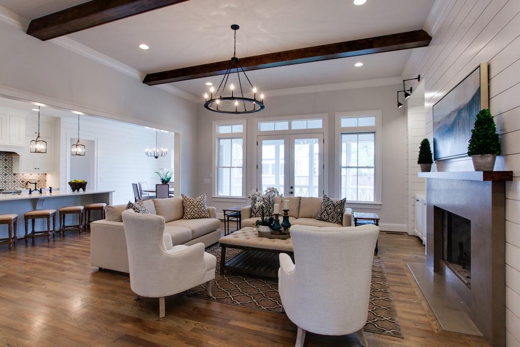 112 Alton Road Nashville, TN 37205 - Photo 8 of 30 a living room with furniture a chandelier and a fireplace